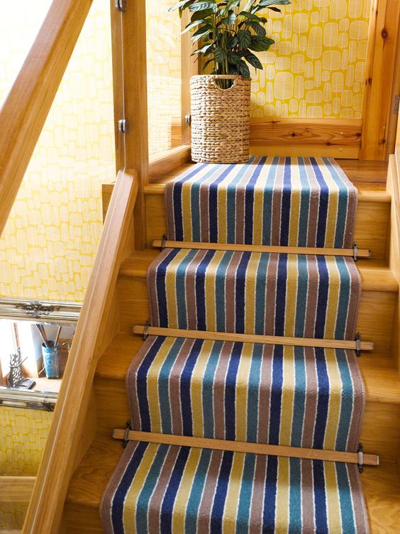 Striped Carpet fitted as a runner to a wooden flight of stairs